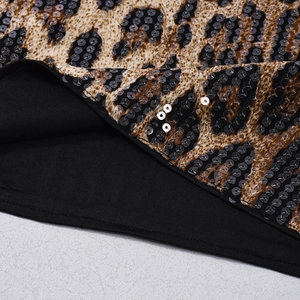 Detailed close-up of leopard print sequins and fine stitching on high waist crop top