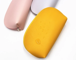 Waterproof PU leather cosmetic bags in pastel colors with water droplets detail