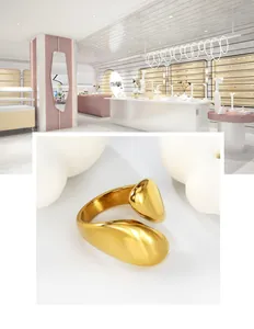 Macro detail of a 18K gold-plated minimalist liquid metal open ring with mirror finish