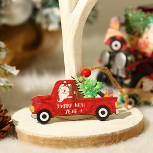 Red wooden Christmas truck ornament with tree and Happy New Year print on a rustic stand