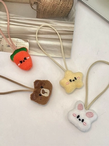 Cute set of four plush animal hair ties featuring carrot, star, bear, and bunny motifs
