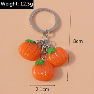 Detailed view of pumpkin keychain with dimensions 8cm length and 2.1cm width measurement