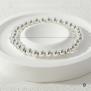 Detailed view of 6mm silver beaded stretch bracelet with 24g weight and 16-17cm length