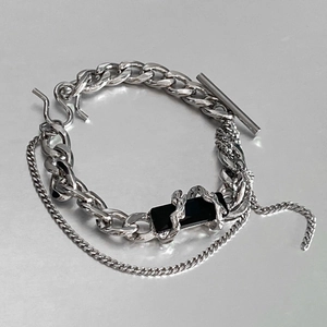 Detail of silver titanium steel chunky link bracelet with black celestial rectangle inlay