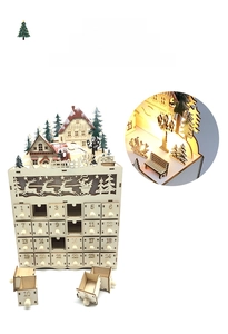 Detail of wooden 24-day advent calendar with laser-cut village scene and LED light