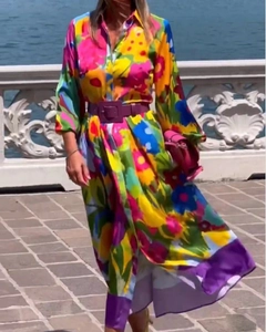 Detail of floral long sleeve maxi dress with shirt collar and purple waist belt