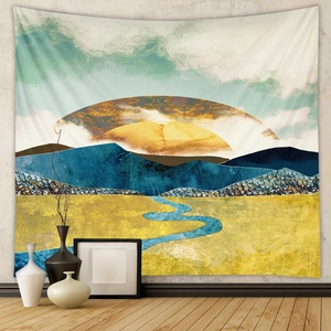 Close-up of abstract mountain landscape tapestry with sun and river on a grey wall