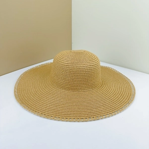 Women's foldable wide brim straw sun hat with elegant lace trim for beach vacations