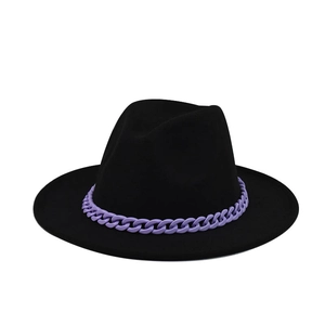 Detail of black wool fedora hat featuring a chunky purple plastic chain accessory