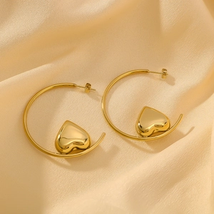 18K gold plated stainless steel hollow heart charm hoop earrings on silk fabric