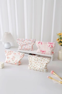 Close-up of cute floral cotton makeup bags with delicate jacquard textures and zippers