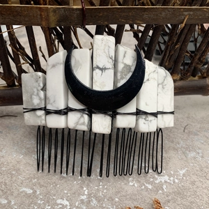 Detail of bohemian hair comb with white marble stones and black crescent moon