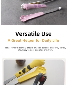 Close-up of cute cat paw shaped food tongs made of stainless steel for salad and bread