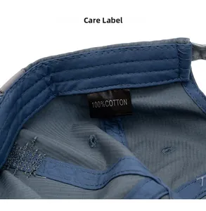 Macro shot of the baseball cap's internal 100% cotton stitching and authentic care label