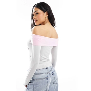 Slim fit two-piece set featuring off-shoulder pink contrast long sleeve top and grey bodice