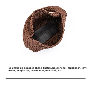 Top view of large woven tote bag showing spacious interior with iPad and daily essentials