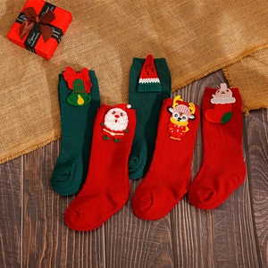 Christmas baby socks set with 3D Santa and reindeer on festive red and green mid-calf knit