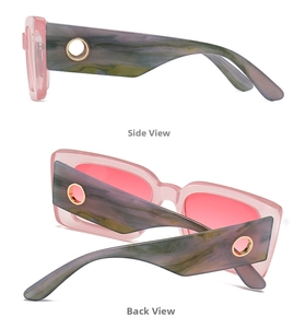Detail of pink transparent frame sunglasses with marble temples and gold metal eyelets