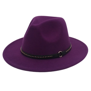Detail of purple fedora hat featuring a black leather belt with gold rivets and metal ring