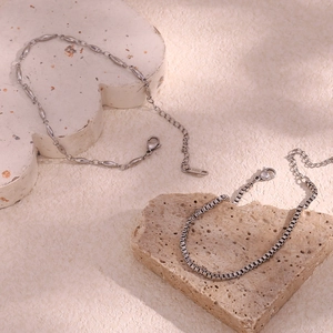 Detail of silver stainless steel box chain and bead chain with 18K engraving