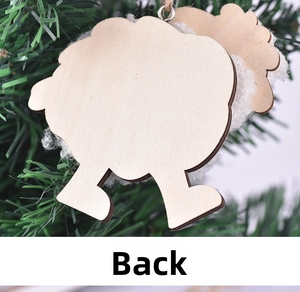 Detail view of the wooden sheep ornament back side with white faux fur on a green tree