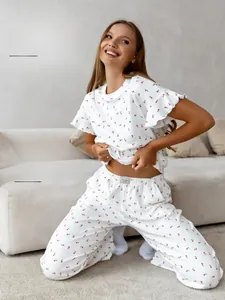 Detail of the elastic waistband and brand label on white heart print pajama pants
