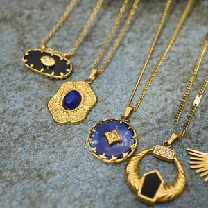 Vintage 18K gold plated necklace with blue natural stone pendants and ornate carvings