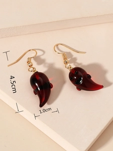 Detail view of burgundy resin ghost earrings with gold hooks and size measurements