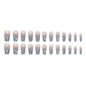 Long trapezoid blue gradient press-on nails with glitter, stars, and rhinestones