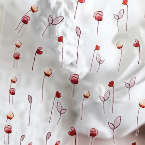 Elegant floral embroidery style nail stickers with matte red petals on white plaster base