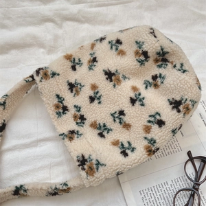 Detail of soft lamb wool tote bag featuring vintage green and brown floral patterns