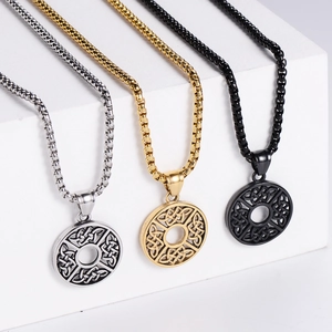 Detail of Celtic knot pendants in silver, gold, and black steel on box chains