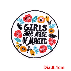 Round embroidered patch with 'GIRLS ARE MADE OF MAGIC' text and flowers, 8.1cm diameter
