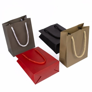 Set of premium matte gift paper bags in various colors with sturdy braided rope handles