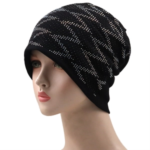 Detailed view of black rhinestone beanie featuring a stylish silver wavy pattern decoration