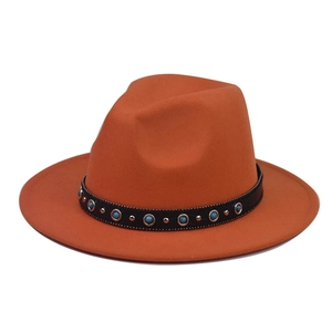Detail of caramel fedora hat with turquoise beads and black leather decorative band