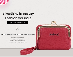 Detail of red lychee leather mini wallet with gold metal clip and hand strap