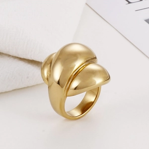 Modern thick golden stainless steel ring with abstract mesh design on white background