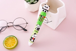 Close-up of green 10-color panda ballpoint pen with 3D topper and multi-color switches