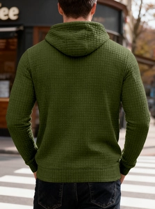 Macro shot of men's dark olive green waffle knit hoodie showing back texture and fit