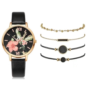 Close-up of women's quartz watch set with floral dial and four stylish bracelets