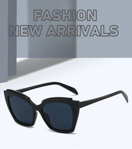 Close-up of stylish black cat-eye sunglasses on a minimalist geometric pedestal