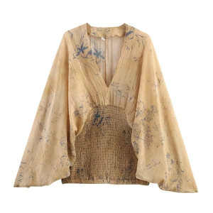 Women's V-neck floral blouse in yellow and blue with elastic waist and batwing sleeves