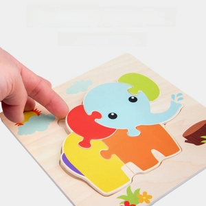 Detail view of wooden elephant puzzle with finger slots for easy piece removal