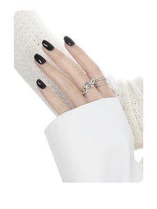 Close-up of double-layer S925 silver ring with three light green round gemstones