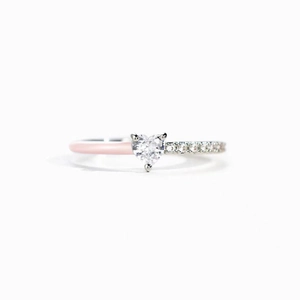 Macro shot of s925 silver ring featuring heart zircon and pink enamel band detailing