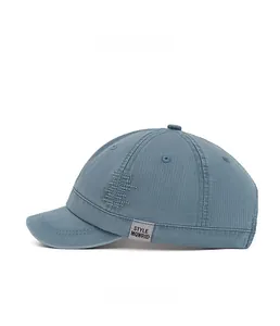 Detail view of cotton twill short brim cap with wave pattern patch and style label