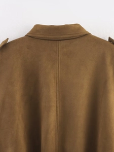 Close-up of the back neckline and fine stitching on a brown suede bomber jacket