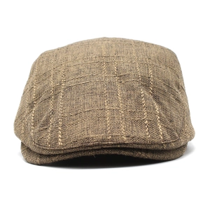Close-up of breathable tan checkered fabric and fine stitching on the classic beret hat