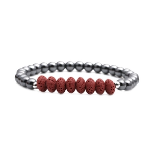 Handmade red volcanic lava and polished grey hematite bead bracelet on white background